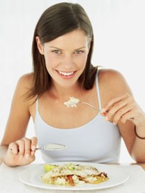 woman eating while suppressing appetite